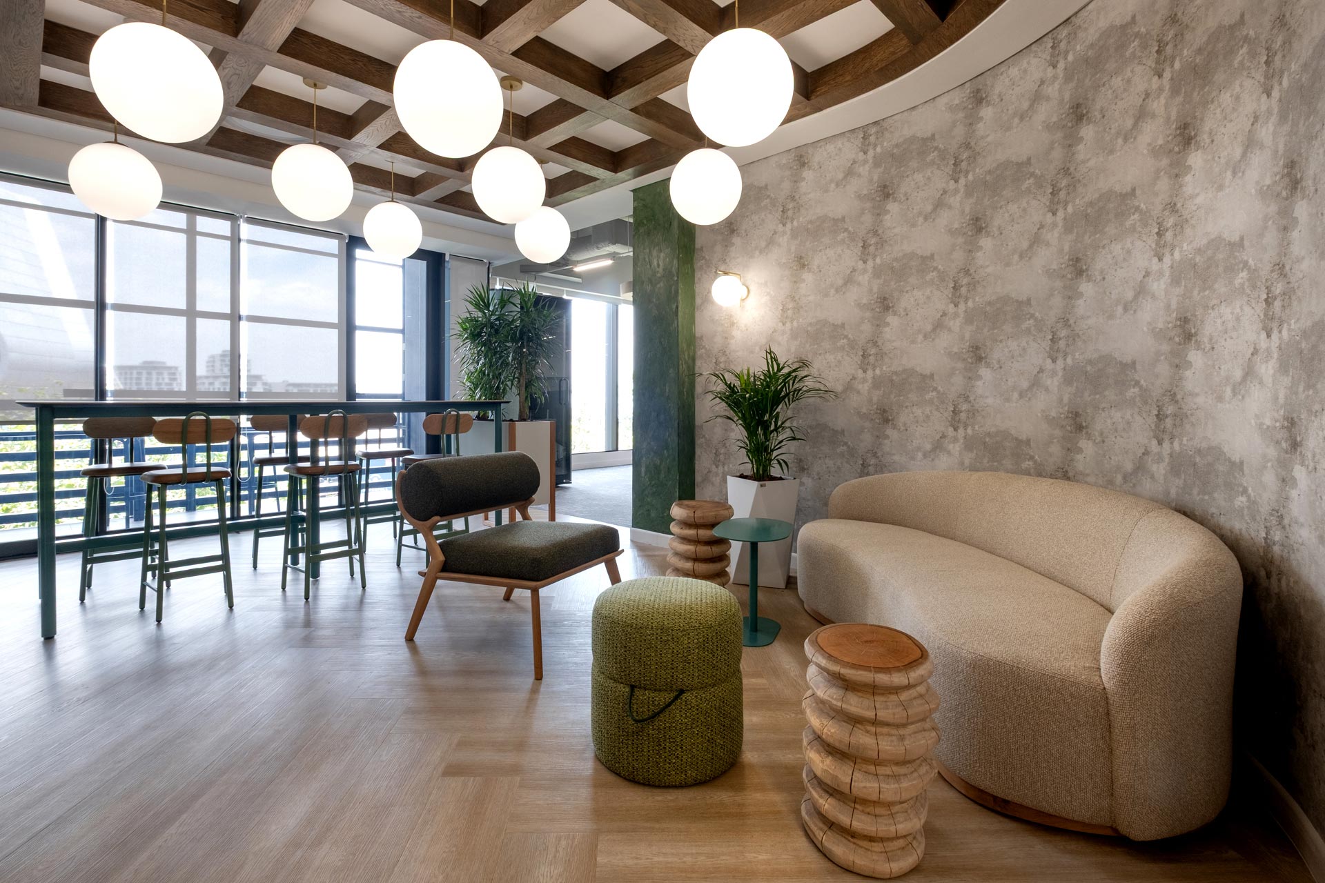 Open-plan seating area with ottomans in BASF office