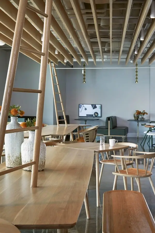 Office space with wooden furniture and ladder feature in BCG office