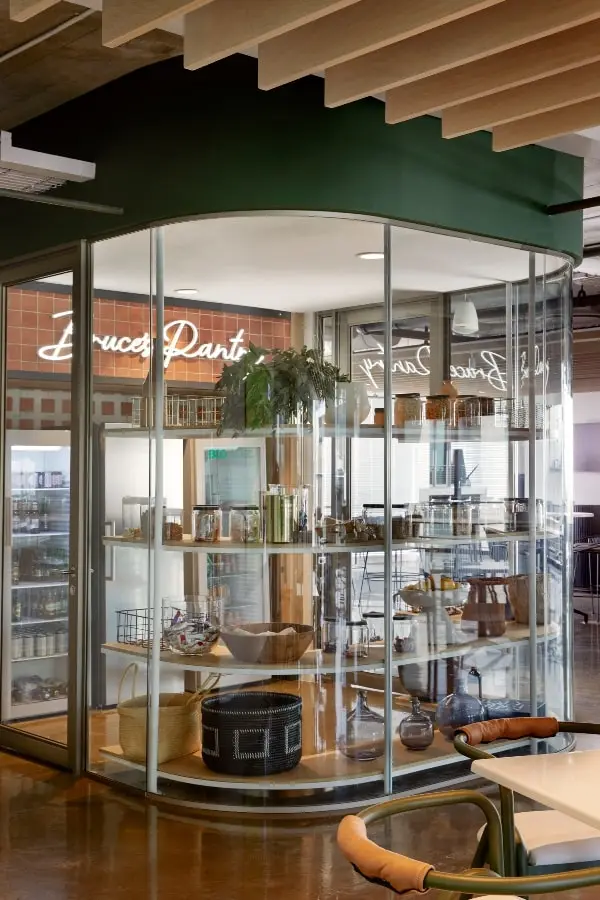 Glass private room with custom shelving in BCG office