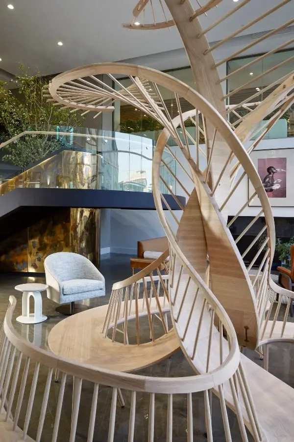 Wooden bench with ladder-style feature structure in BCG office