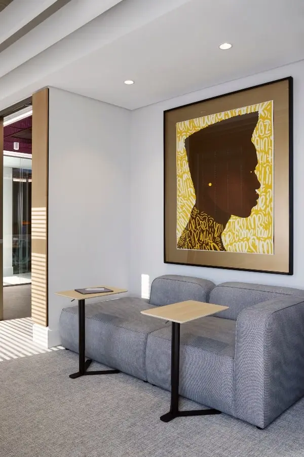 Office space with African artwork and laptop tables in BCG office