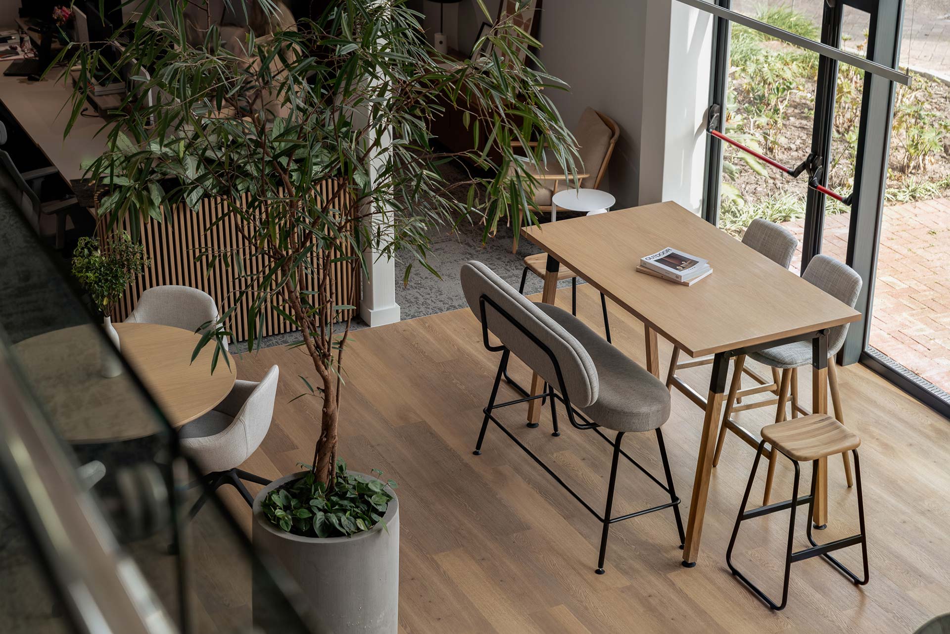 Informal meeting space with bar stools and table in DCL showroom in Cape Town