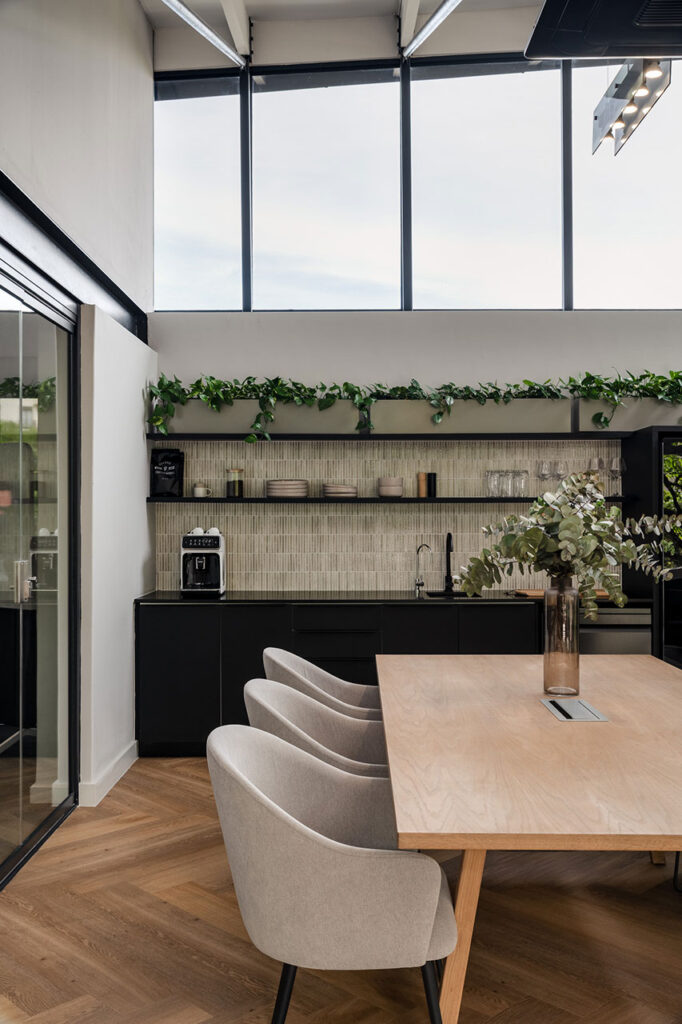 Kitchen area with table and seating in modern DCL showroom in Cape Town