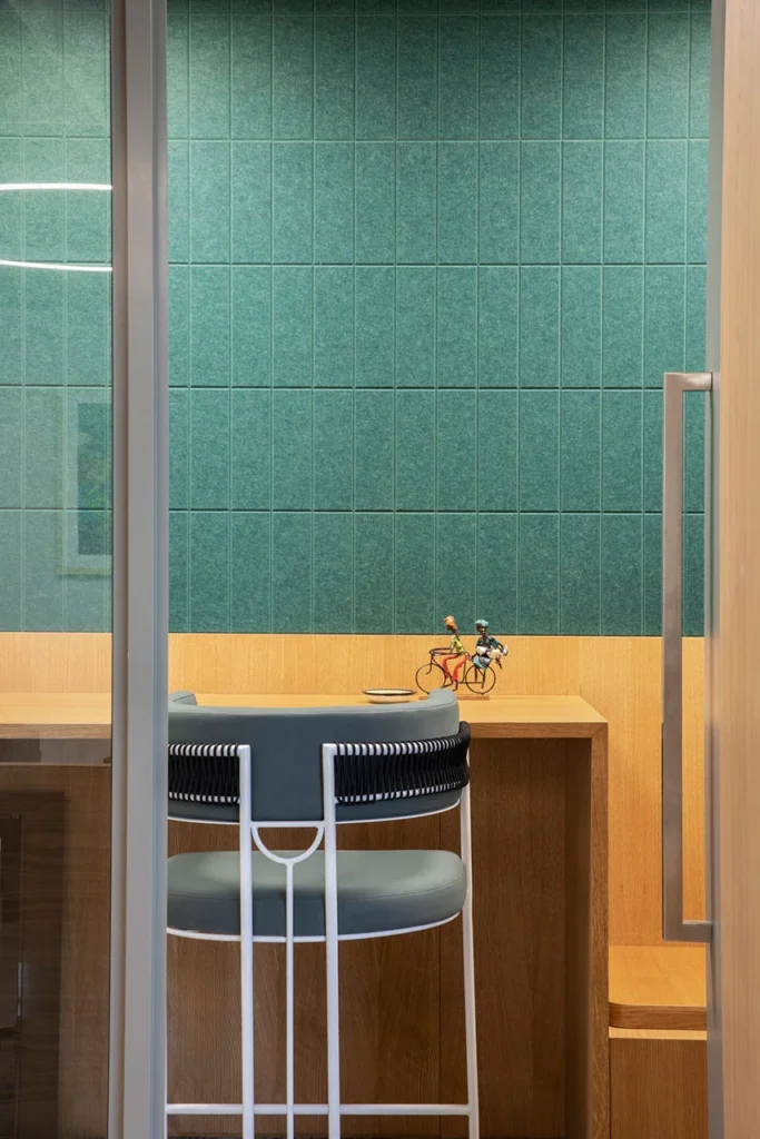 Focus room with bar chair and tiled wall in European Investment Bank office in Johannesburg