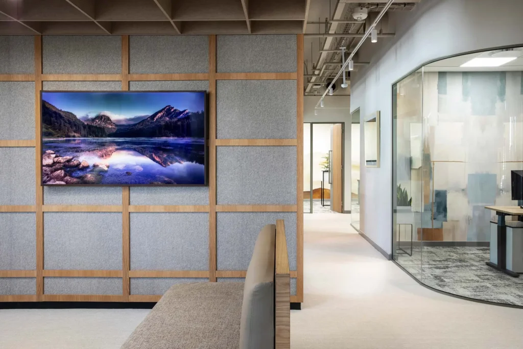 Workspace with acoustic wall panels, wood detailing in European Investment Bank office in Johannesburg