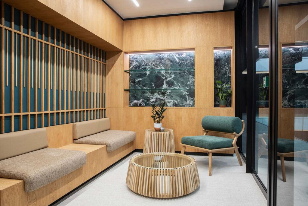 Reception area with bench seating and wooden panel finishes in European Investment Bank office in Johannesburg