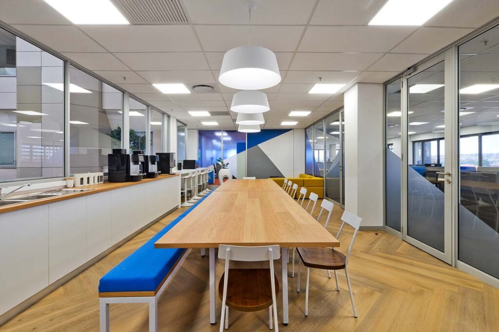 Canteen area with long tables and lighting for HP office in Johannesburg