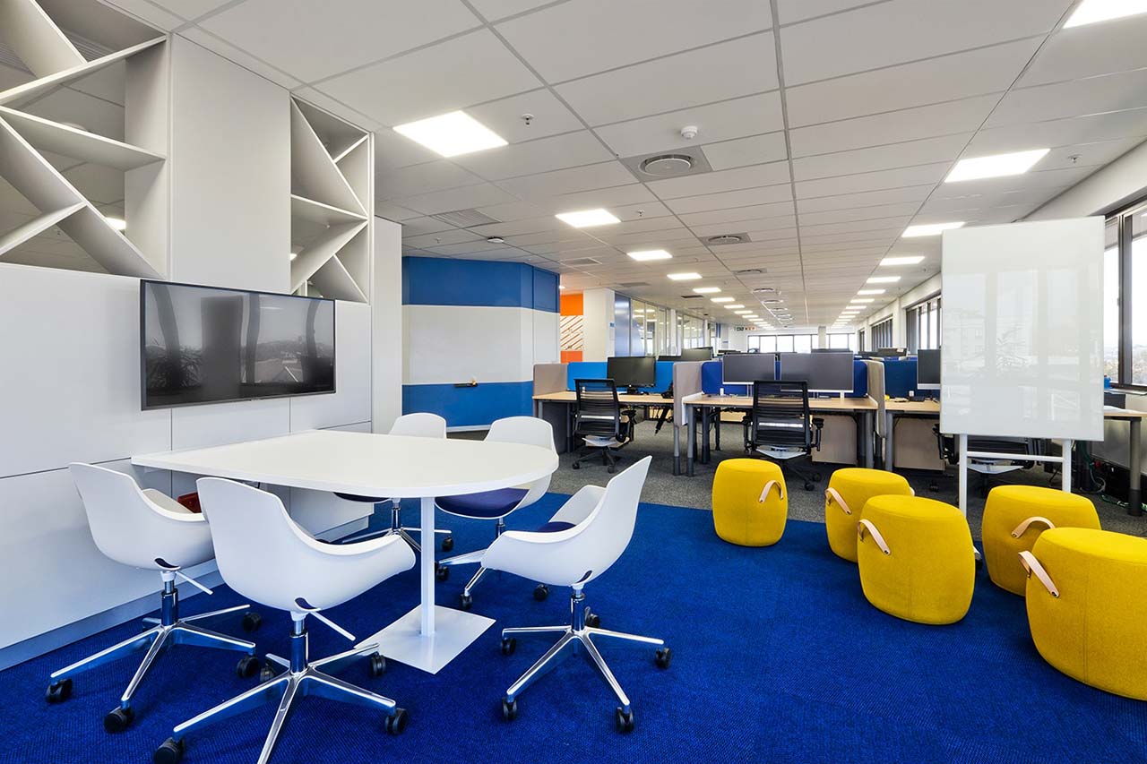 Workspace with ottomans and carpeted workstations for HP office in Johannesburg