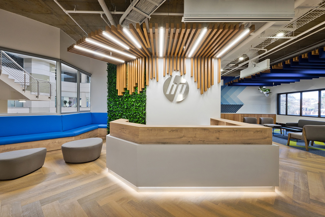 Reception area with linear LED pendant lighting for HP office in Johannesburg