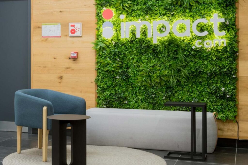 Reception area with furniture and greenery wall in Impact office in Cape Town