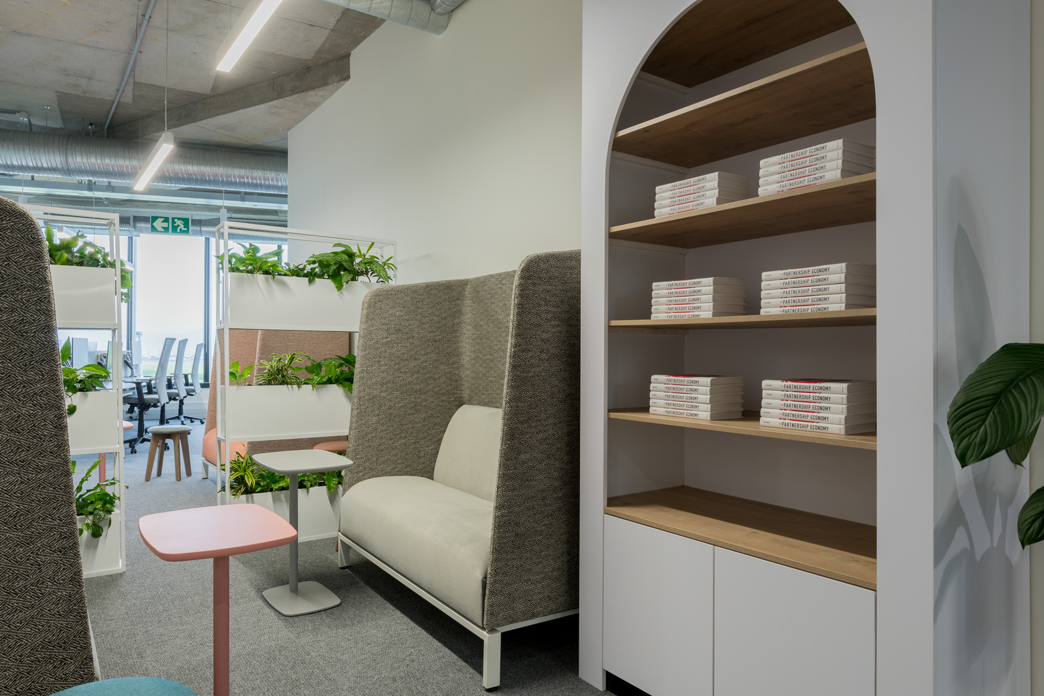 Quiet booths with seating and bookshelf in Impact office in Cape Town