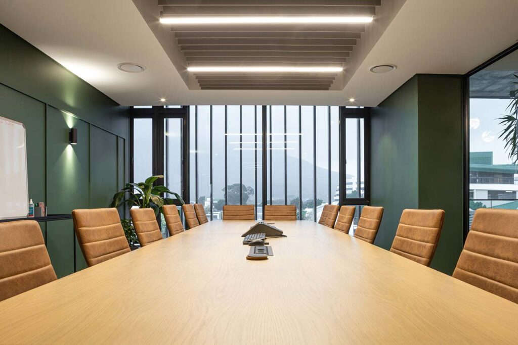 Boardroom with table and chairs in Inspired Evolution office in Cape Town
