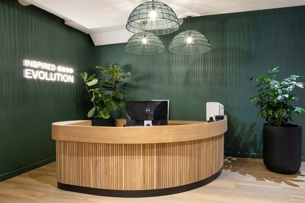 Reception desk with custom wooden office furniture in Inspired Evolution office in Cape Town