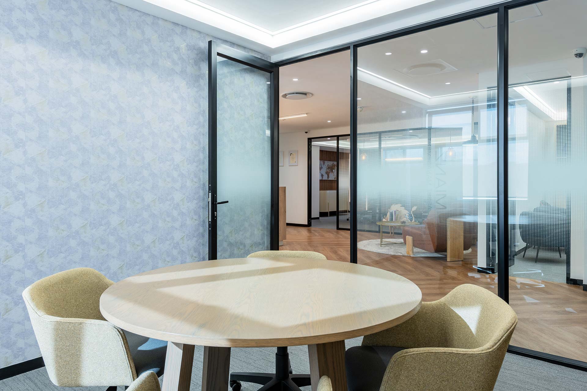Private meeting room with round table and furniture in Mianzo office in Cape Town