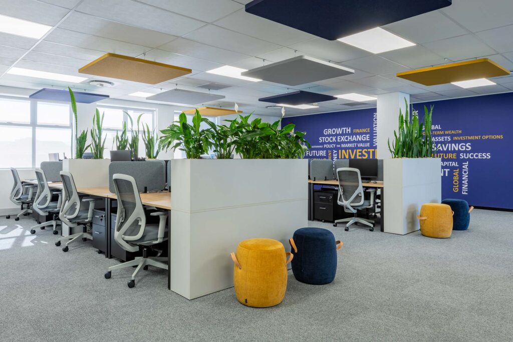 Open plan workstation with planters and ottomans in Mianzo office in Cape Town