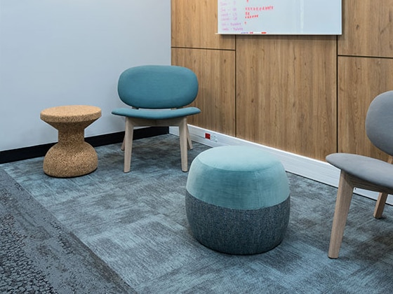 Informal seating area with ottomans in Payfast office in Cape Town
