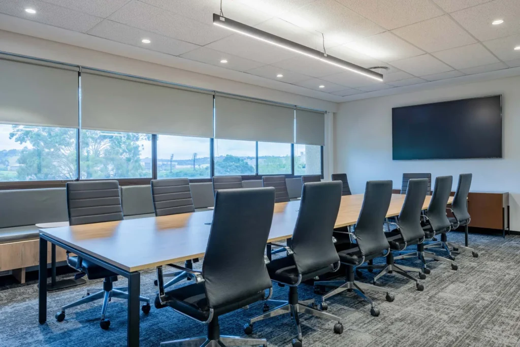 Boardroom with long meeting table and TV for PepsiCo in Cape Town