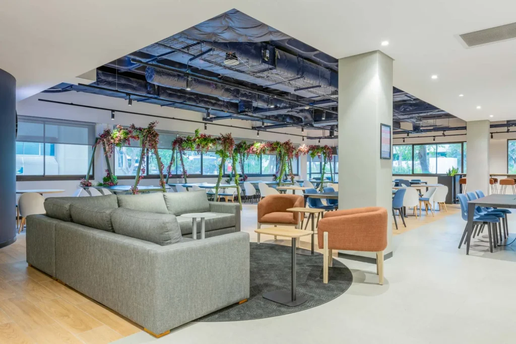 Canteen space with large couch seating for PepsiCo office furniture in Cape Town