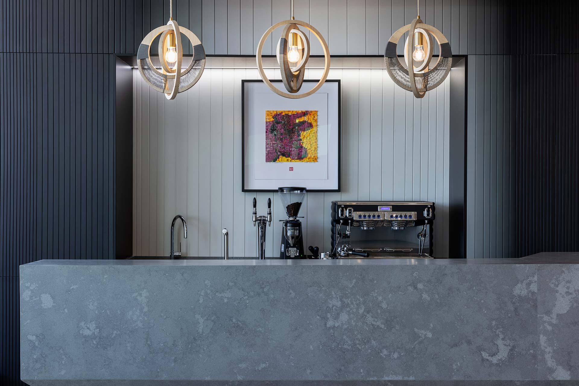 Canteen area with sculptural pendant lighting and furniture in Pinsent Masons in Rosebank
