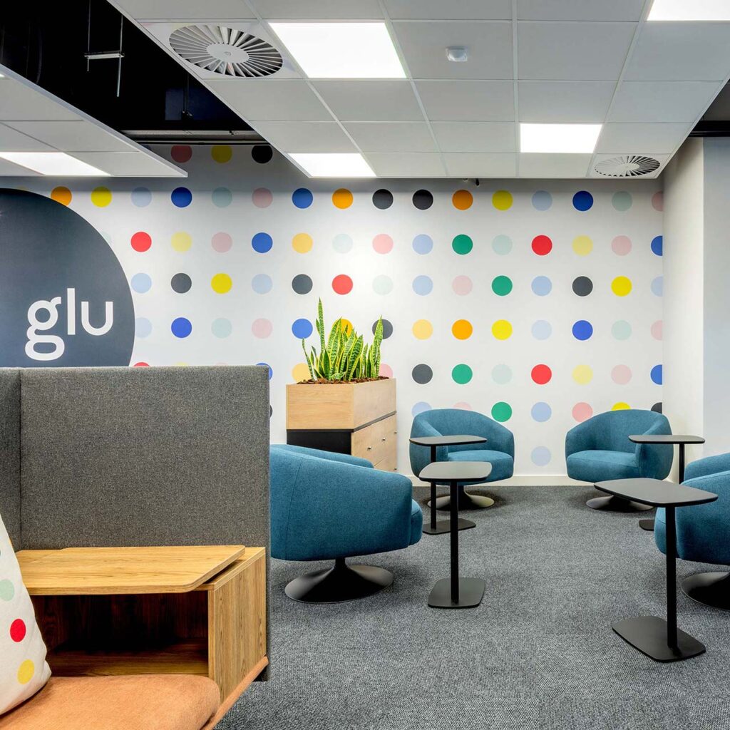 Meeting area with flexible office furniture and feature wallpaper at PPS in Cape Town