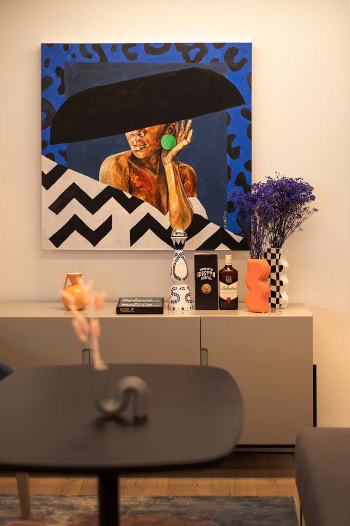 Workspace with wall art and cupboards for audio streaming client in Cape Town