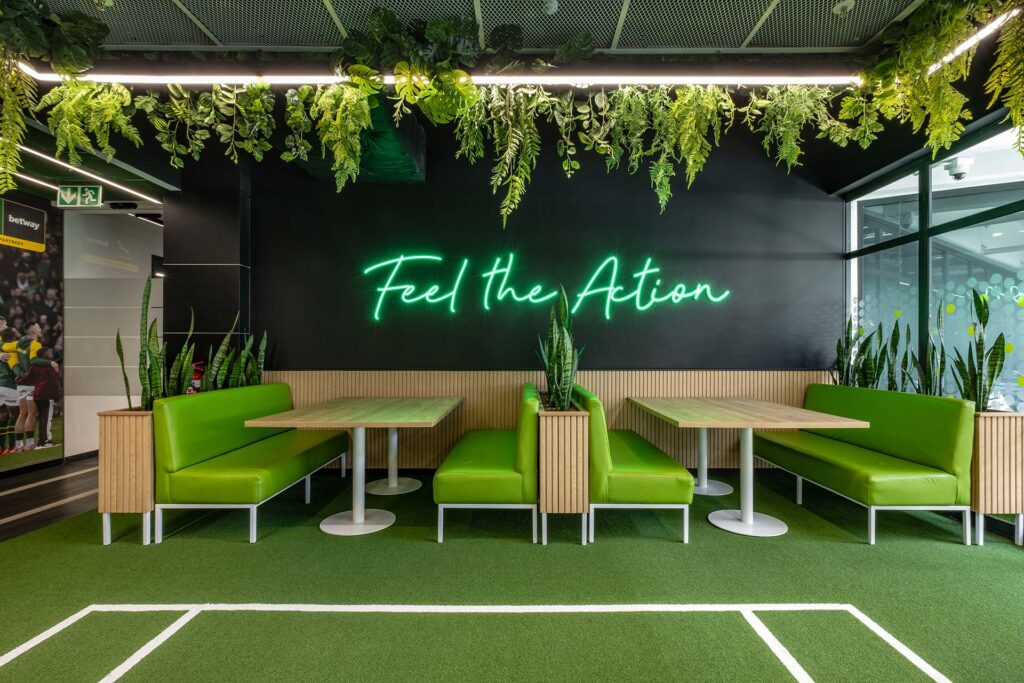 Canteen with green couches and tables for private digital services client in Johannesburg