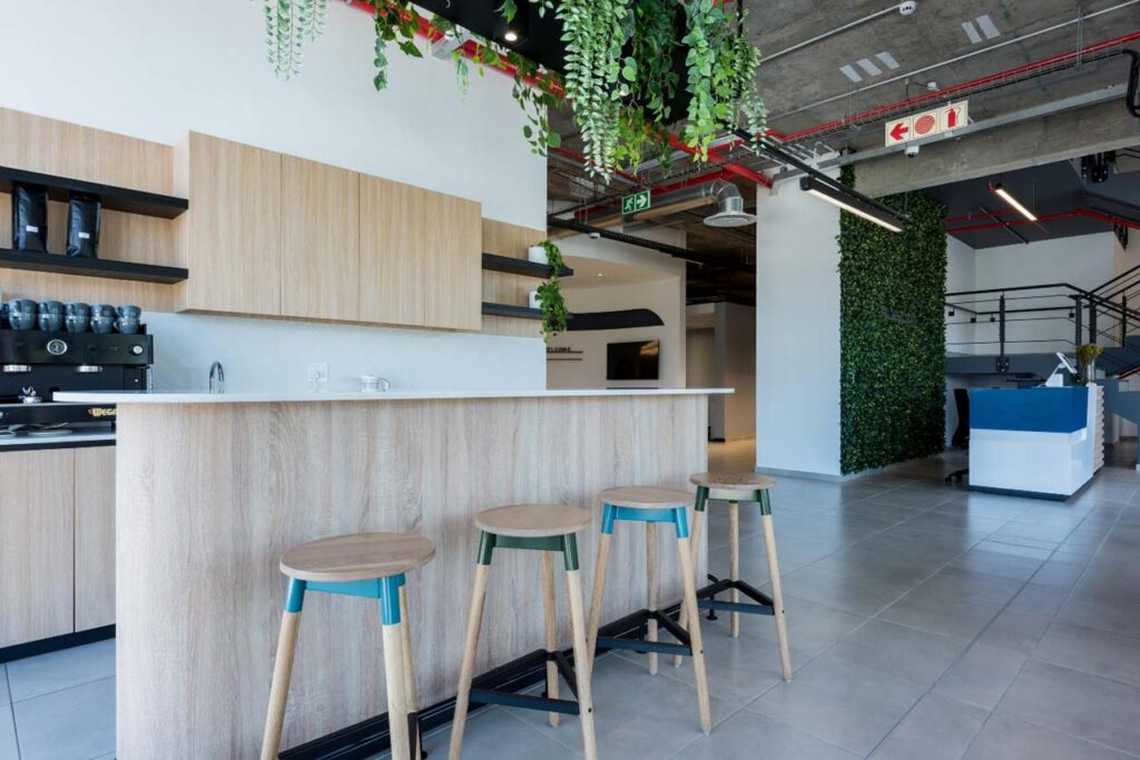 Kitchenette with furniture and bar stools in Rubicon office in Cape Town