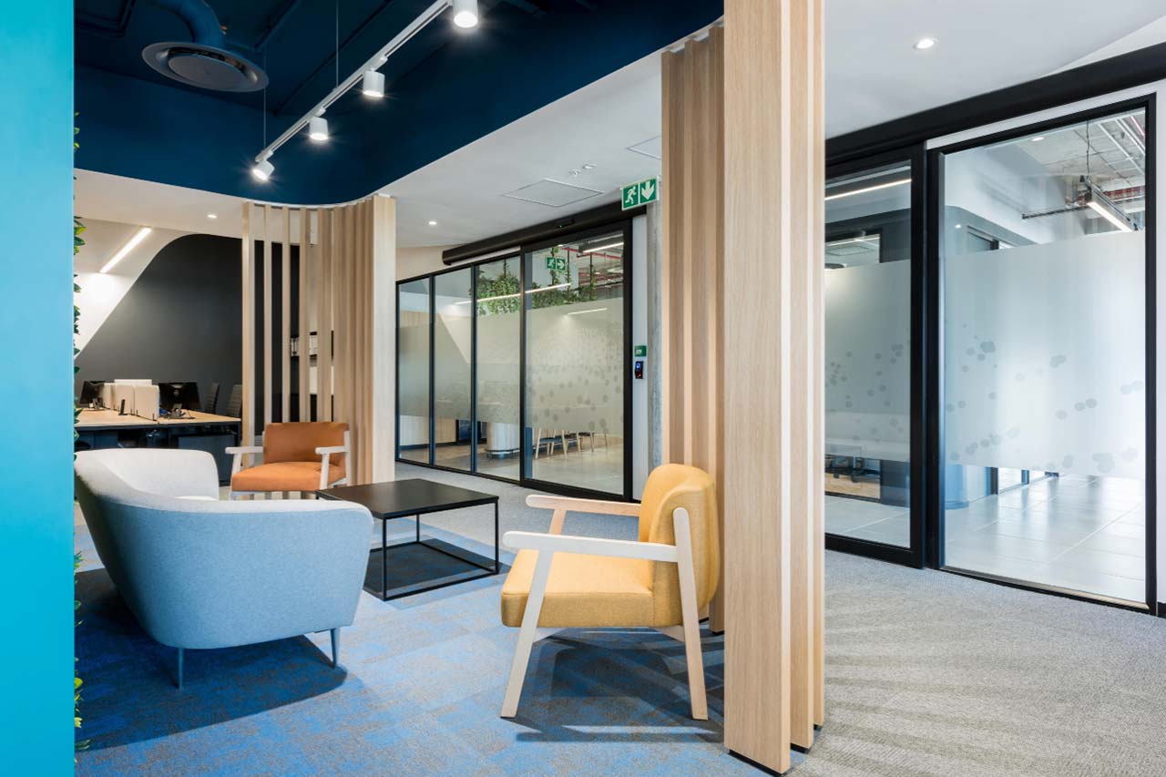 Informal meeting lounge with couches and armchairs in Rubicon office in Cape Town