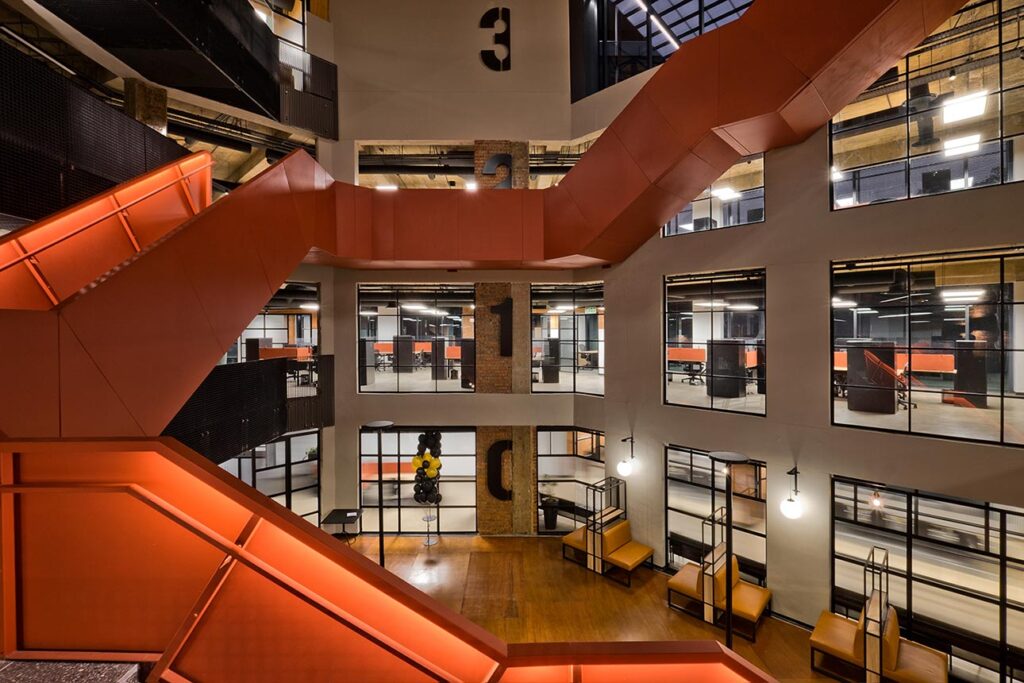 Modern atrium workspace with feature staircase for Thungela in Johannesburg