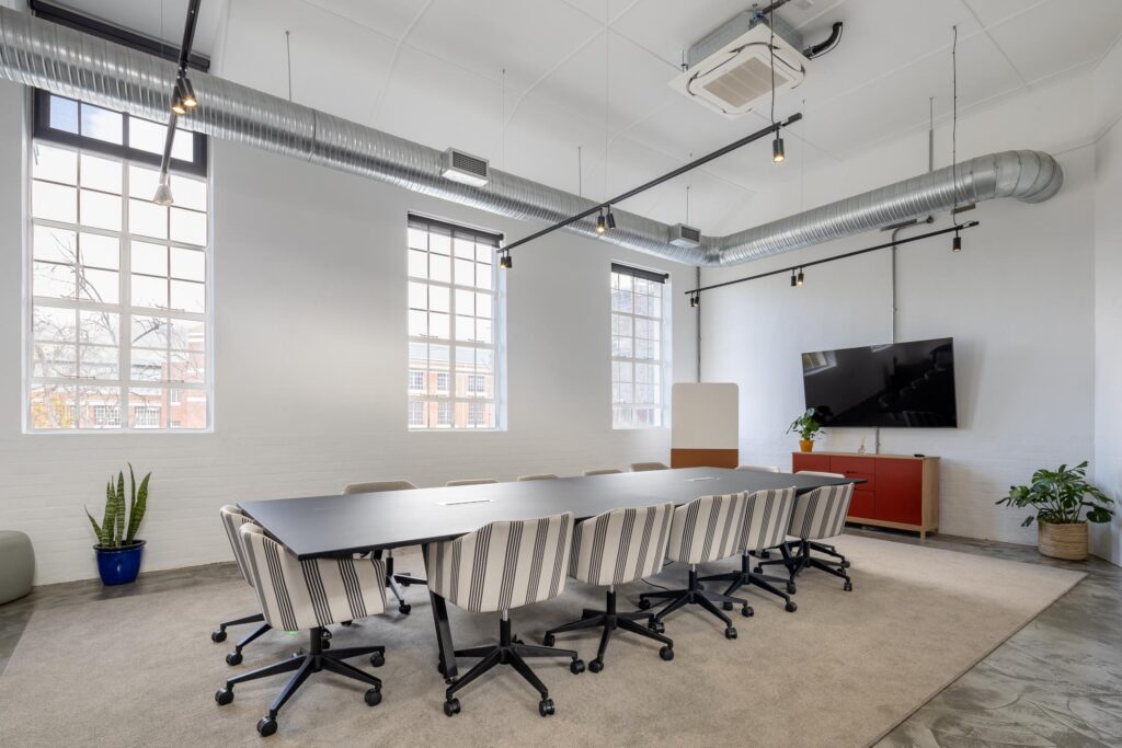 Executive boardroom for cost certified with long meeting table upholstered boardroom chairs and integrated storage for design led furniture procurement