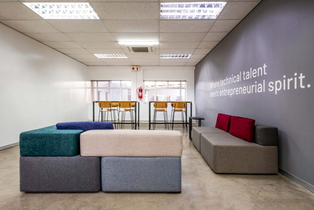 Allan Gray Makers Bryanston reception area: commercial furniture including custom couches and barstools.