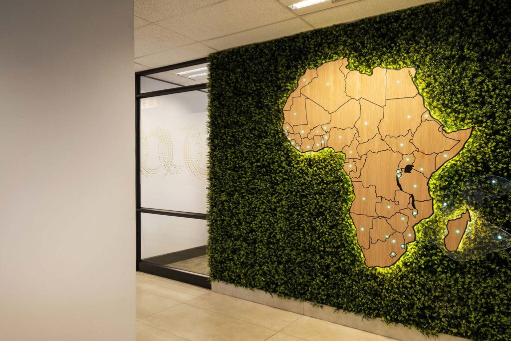 ATAF office interior featuring contemporary commercial furniture and a green feature wall