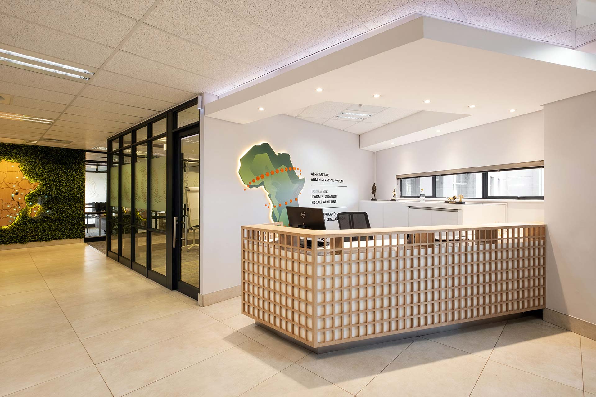 ATAF reception area featuring a contemporary reception desk supplied through Design Colab's turnkey furniture solutions