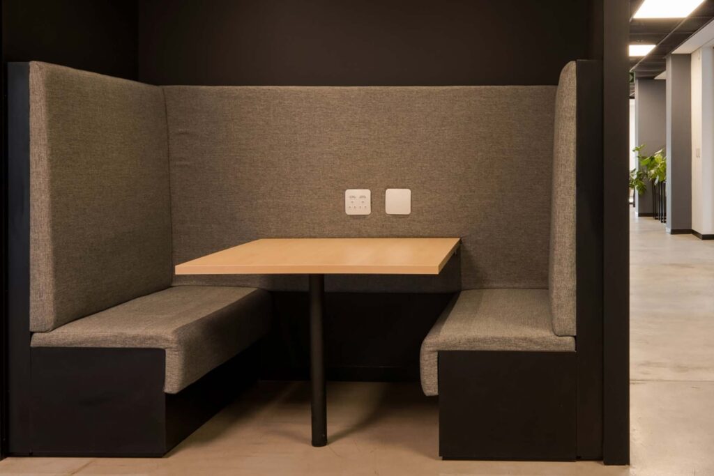 BOB Group office with custom booth seating, integrated power points, acoustic soundproofing and a bespoke fabric bench
