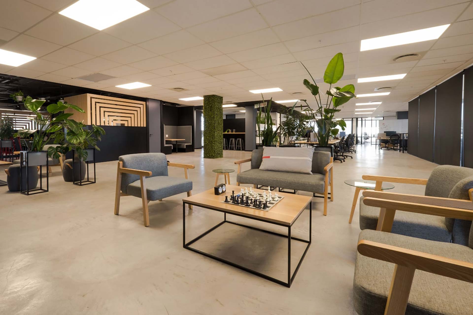 BOB Group Menlyn Maine commercial office with flexible FF&E furniture, chairs, couches, planters and coffee tables throughout the open-plan workspace