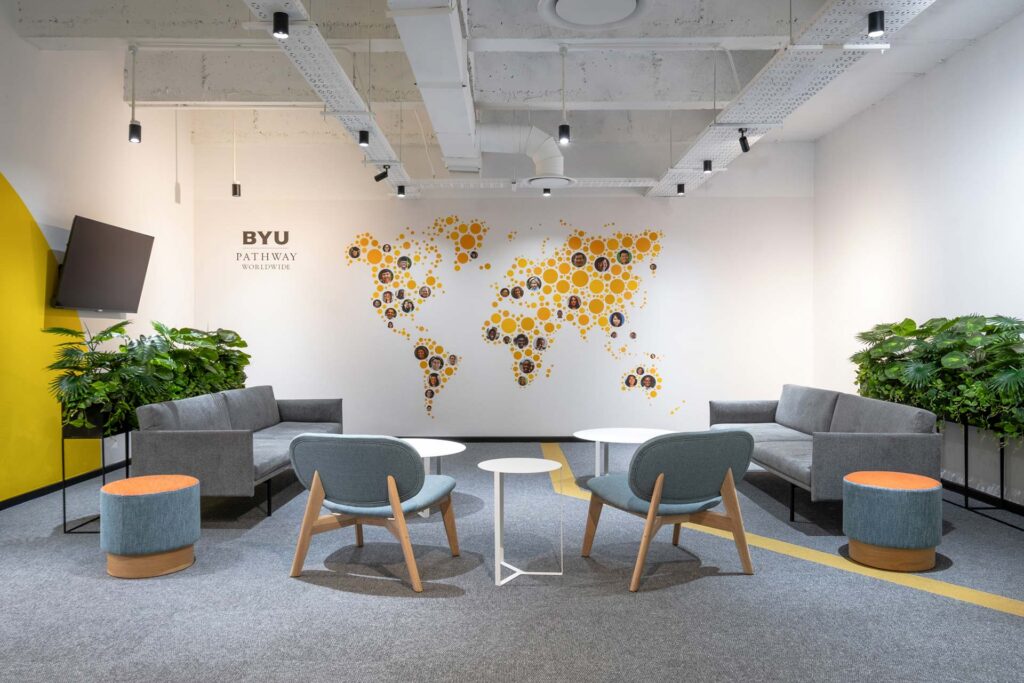 BYU South Africa university campus reception area with a contemporary couch seating solution and planters, supplied by Design Colab.