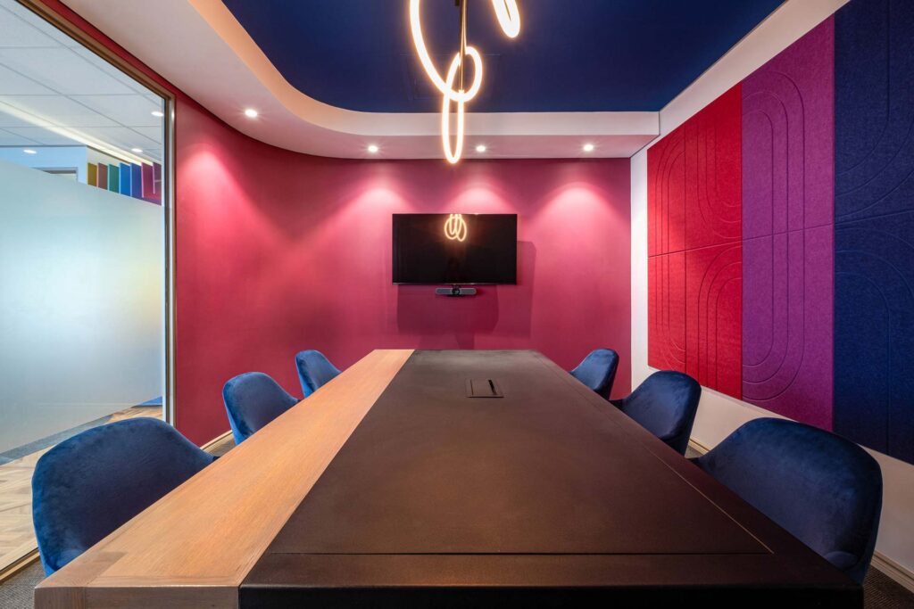 Cloud Ace commercial office in Joburg, featuring a boardroom with office chairs, a boardroom table, and acoustic panels.