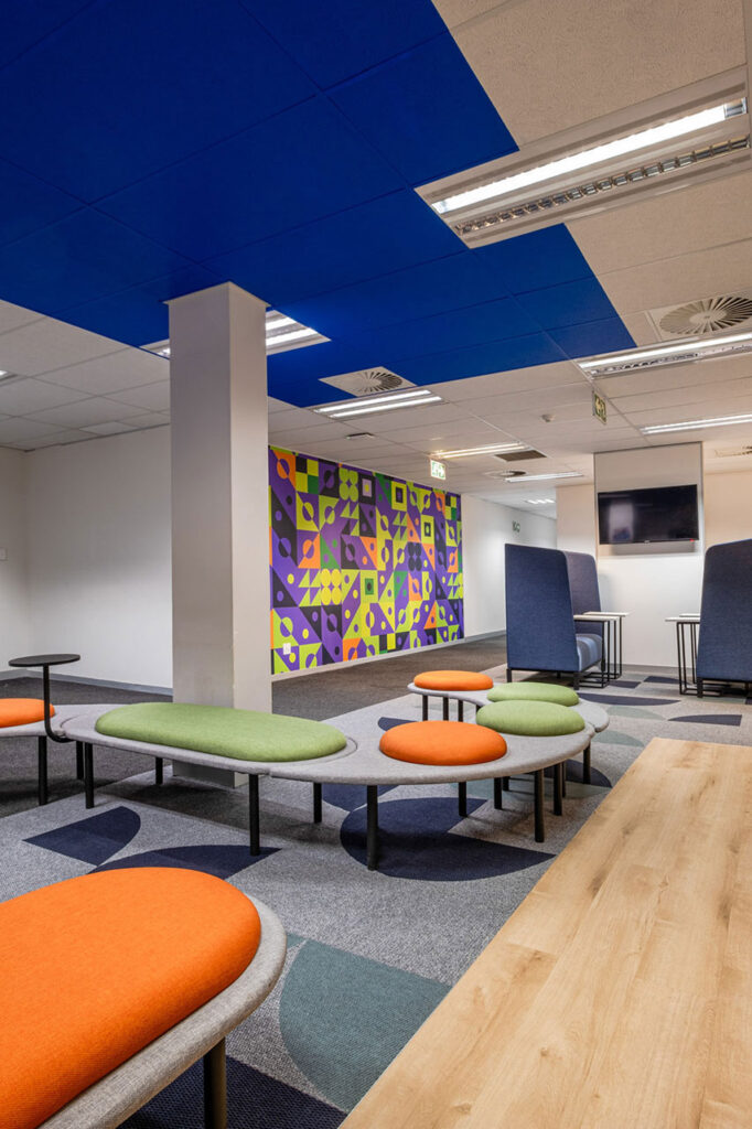 Eduvos Pretoria student area with acoustic booths and custom seating designed to reflect the brand and support flexible student spaces