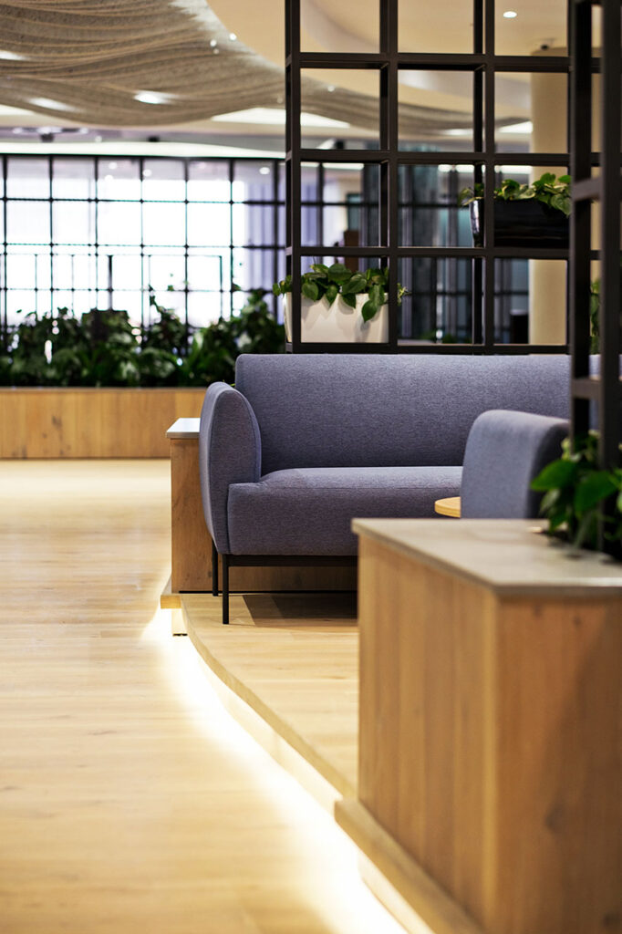 Liberty Sandton office interior with contemporary couches, reception seating, plants and curated décor supplied by Design Colab