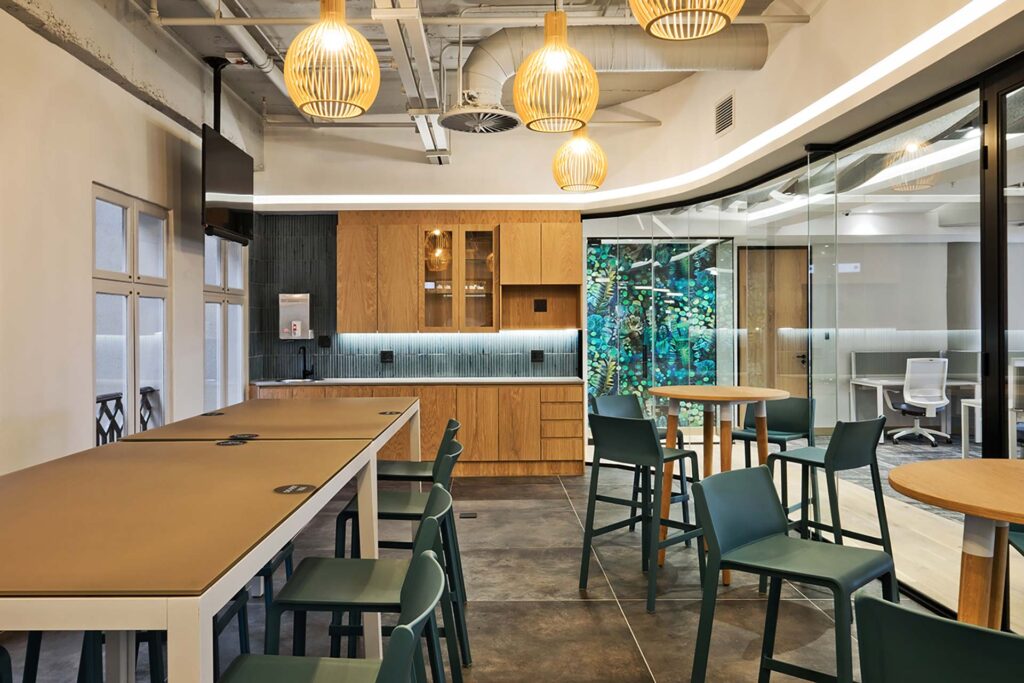 Liberty Sandton office canteen with contemporary chairs, tables and bar stools creating a collaborative workplace dining area supplied by Design Colab