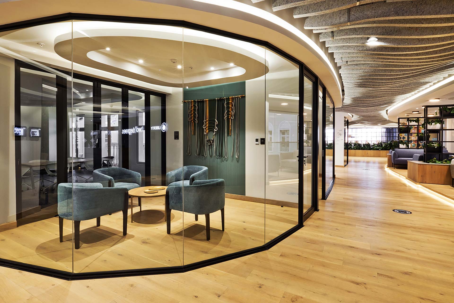 Liberty Sandton corporate office featuring visitor chairs, planters and contemporary office furniture, procured and supplied by Design Colab