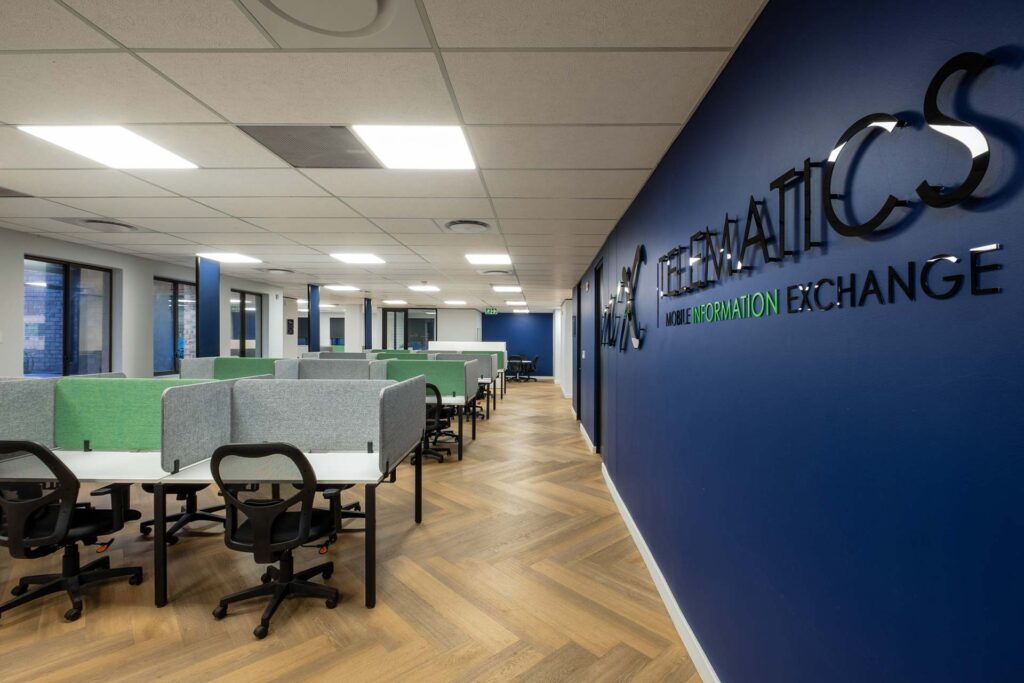 Mix Telematics open-plan office with furniture, FFE solutions, desks, ergonomic chairs and privacy screens, providing a flexible workplace fit-out solution