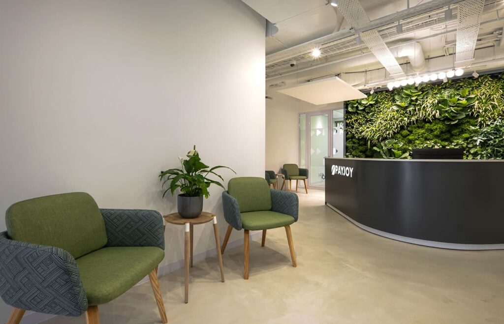 PayJoy Johannesburg commercial office reception area with modern visitor chairs, a reception desk and coffee table