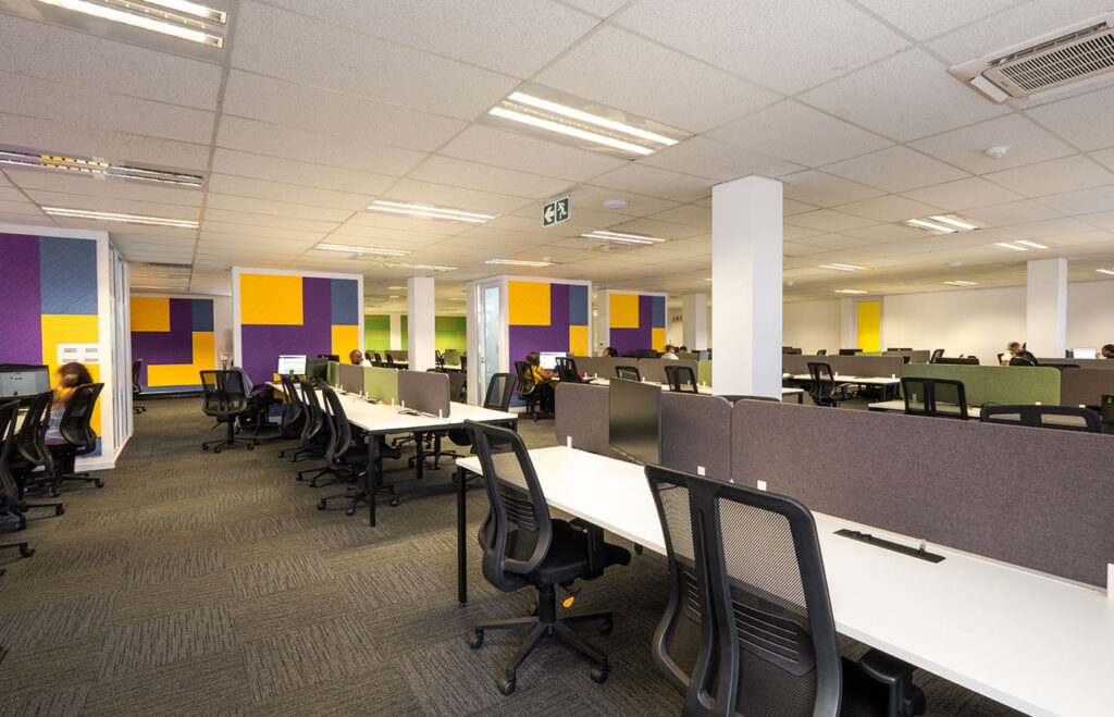 PayJoy Johannesburg office with modern desks, ergonomic chairs, partition screens and acoustic panels