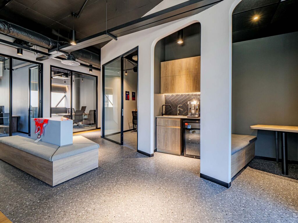 Sportradar office with a custom central seating bench as part of a flexible workplace furniture solution