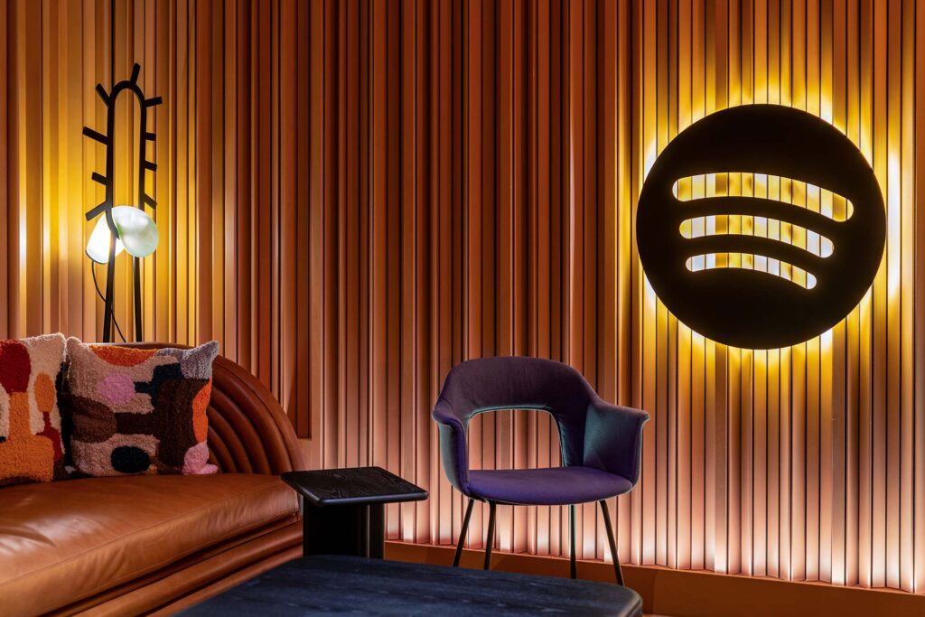 Spotify new office benefitted from furniture procurement services featuring a south african designer lamp