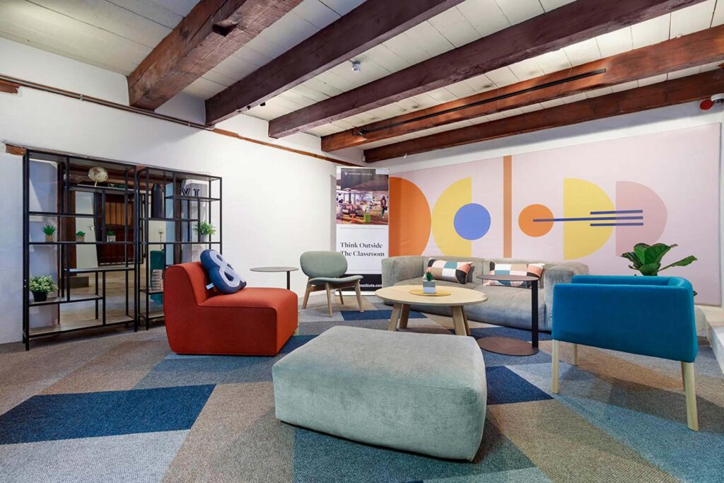Valenture learning facility reception area with modern seating and custom-designed furniture by Design Colab