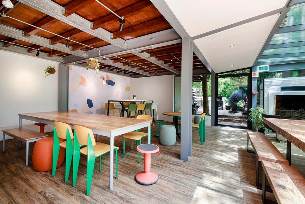 Valenture Cape Town canteen area with mixed seating, benches, bar stools and ottomans sourced by Design Colab as part of an FF&E solution