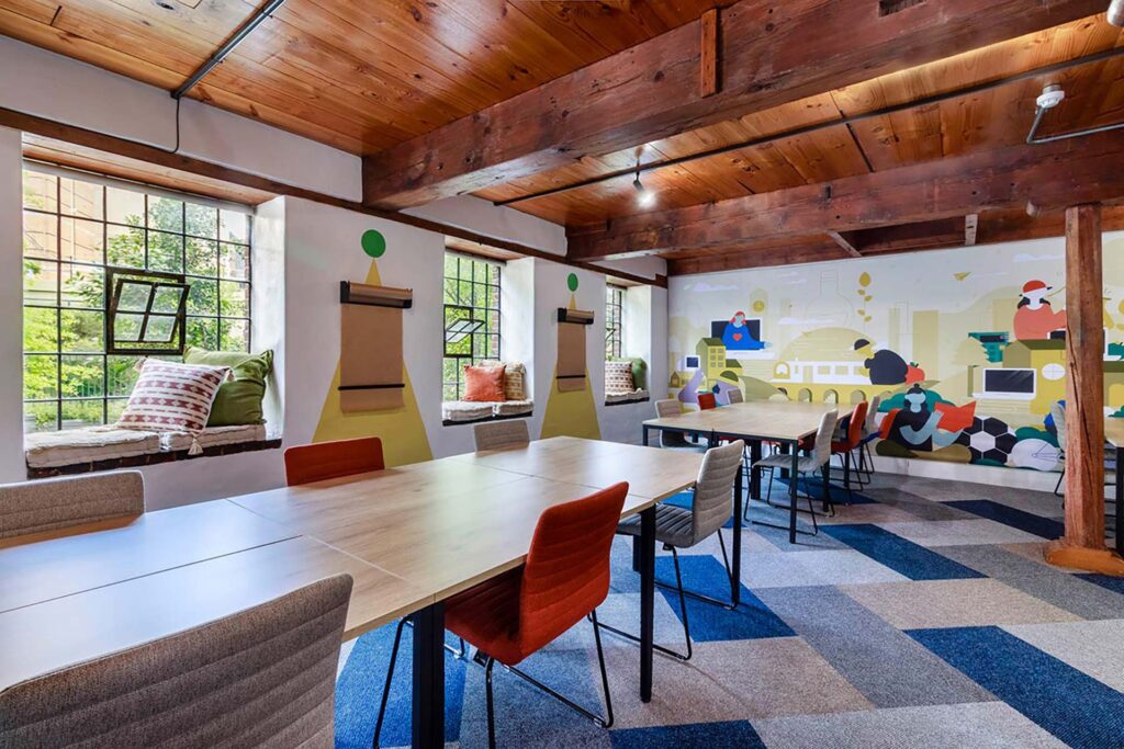 Valenture Cape Town open-plan student workspace with colourful chairs and a vibrant, contemporary interior supplied by Design Colab