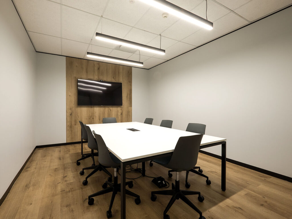 Atlas Copco SA modern boardroom with corporate office furniture, meeting table and chairs